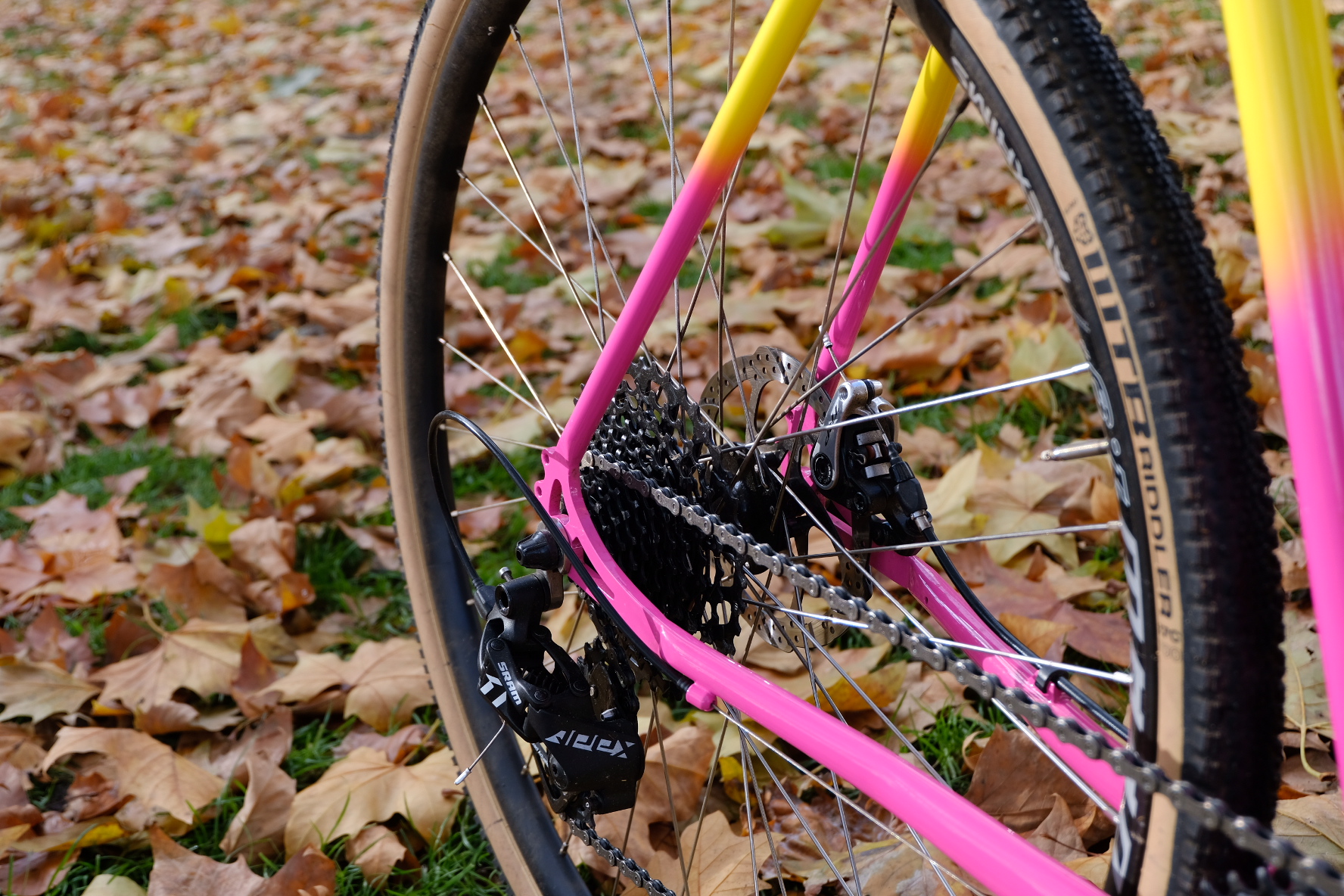 close up of yellow and pink bike