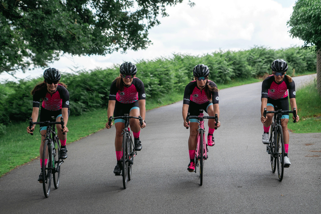 InternationElles unofficial female Tour de France cycle team, four team members on bikes - credit Attacus Cycling Press Handout