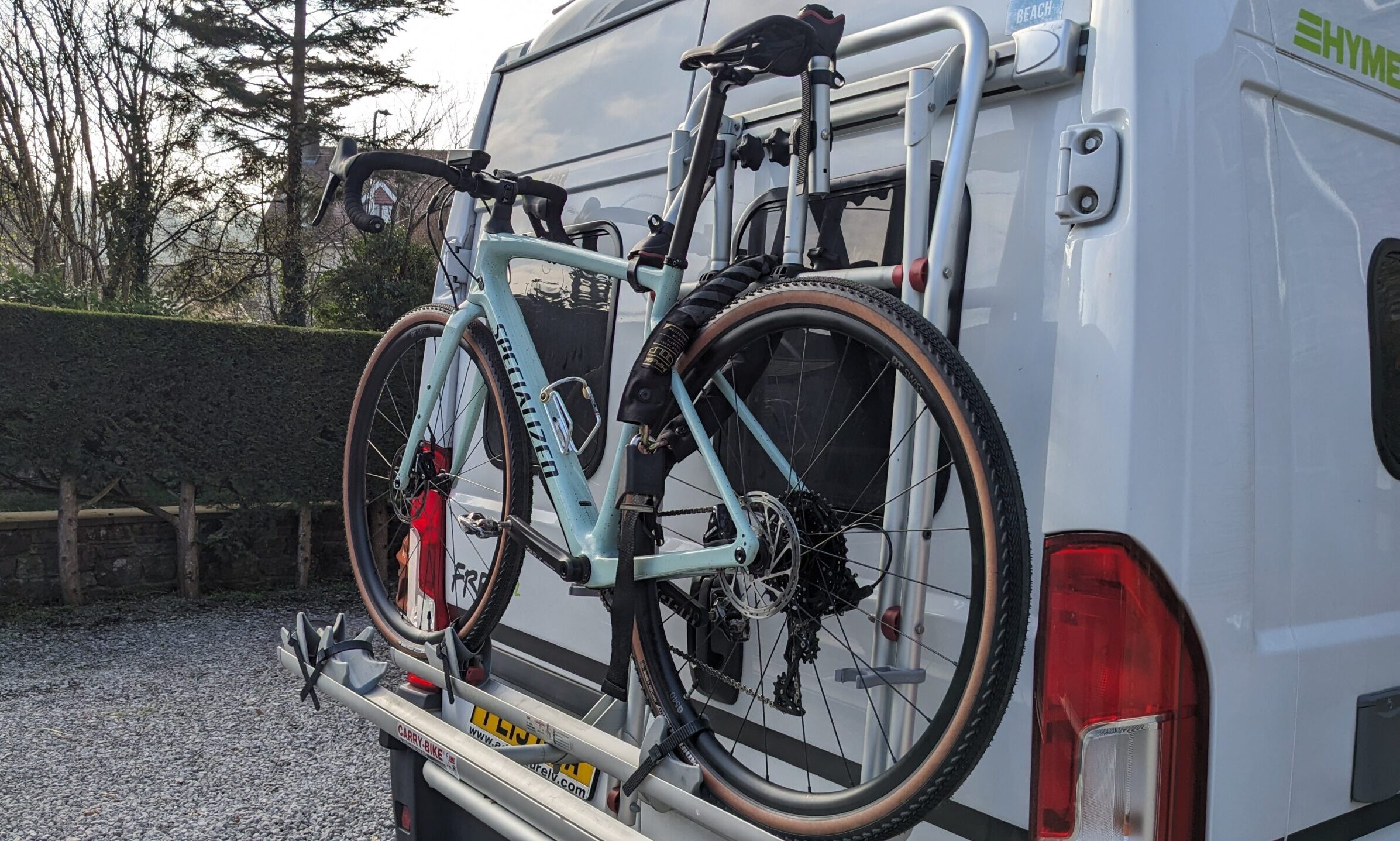 Bicycle locked to the back of a motorhome