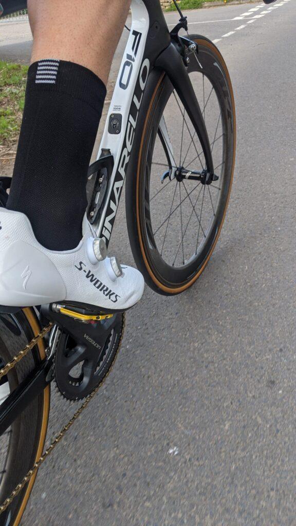 Cycling shoes on a wooden floor